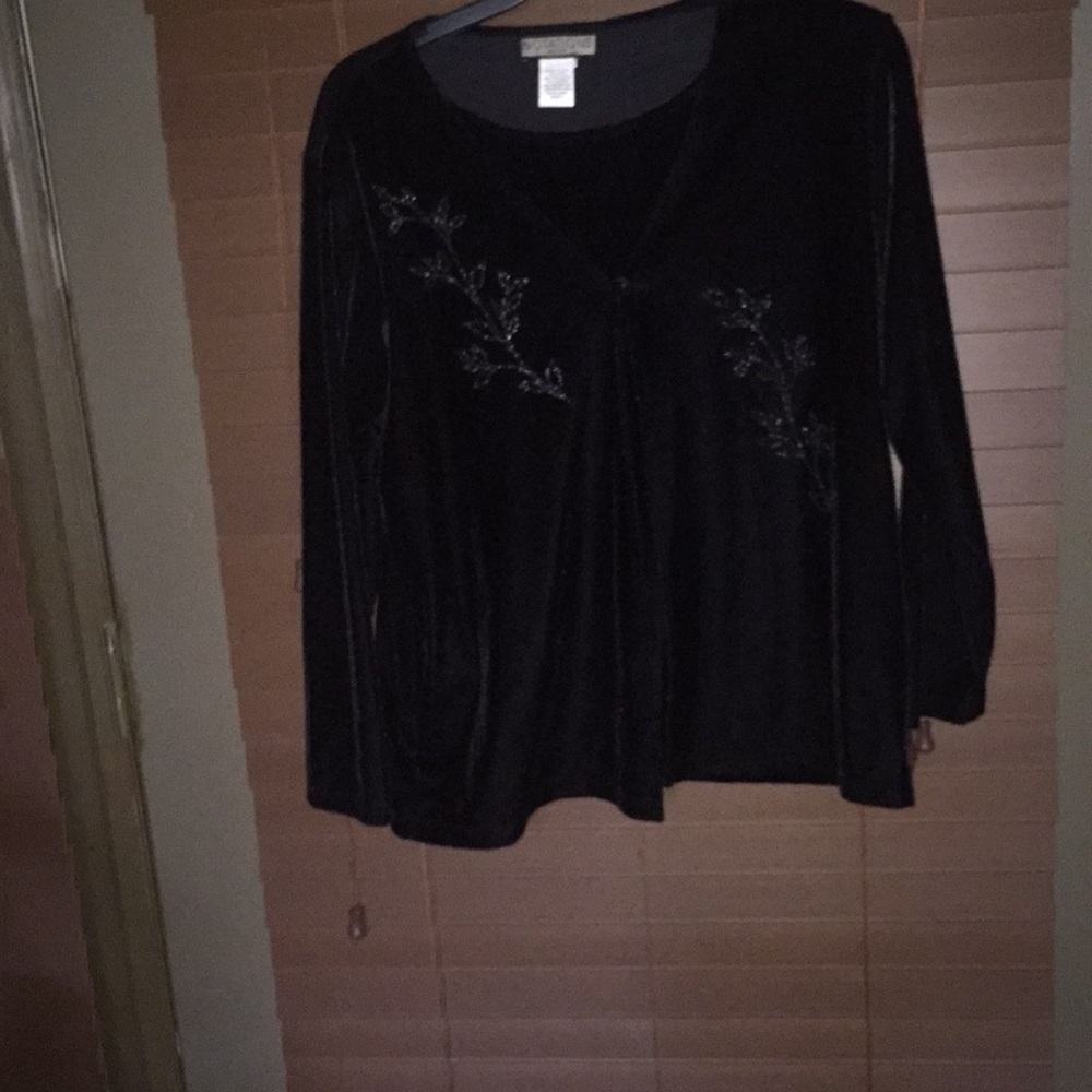 Long sleeve sweater with attached blouse.